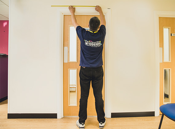 Handyman mounting a TV in a South London property