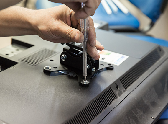 Handyman mounting a TV