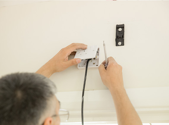 Handyman installing a socket